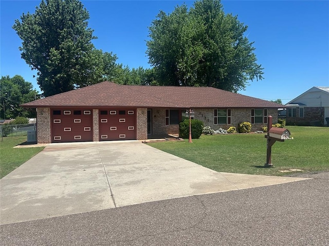1721 E Ridgeview Ter, Mustang, OK 73064 - ranch-style home with a garage, concrete driveway, brick siding, and a front yard