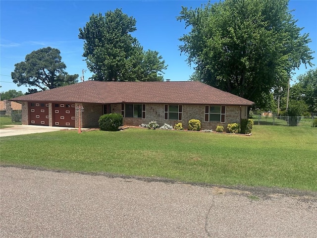 1721 E Ridgeview Ter, Mustang, OK 73064 - single story home with an attached garage, fence, driveway, and a front yard