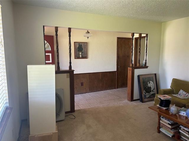 1721 E Ridgeview Ter, Mustang, OK 73064 - hall with carpet flooring, a textured ceiling, a wainscoted wall, and wooden walls