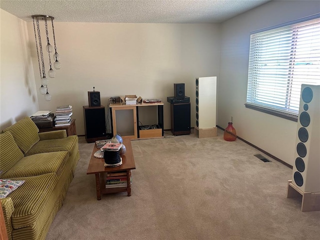 1721 E Ridgeview Ter, Mustang, OK 73064 - living room featuring light colored carpet, a textured ceiling, and visible vents