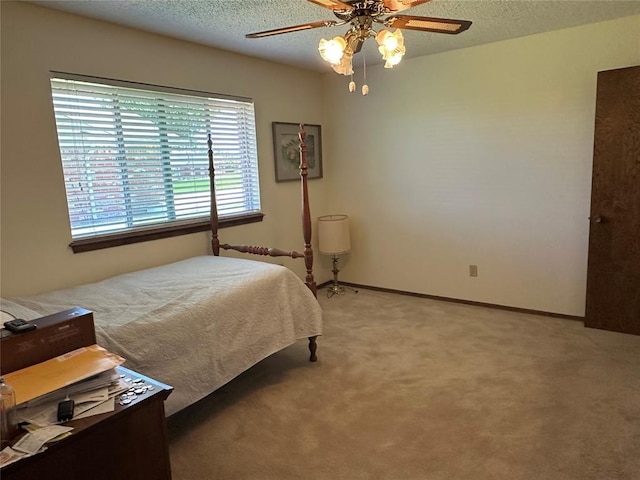 1721 E Ridgeview Ter, Mustang, OK 73064 - bedroom featuring baseboards, a textured ceiling, light colored carpet, and ceiling fan
