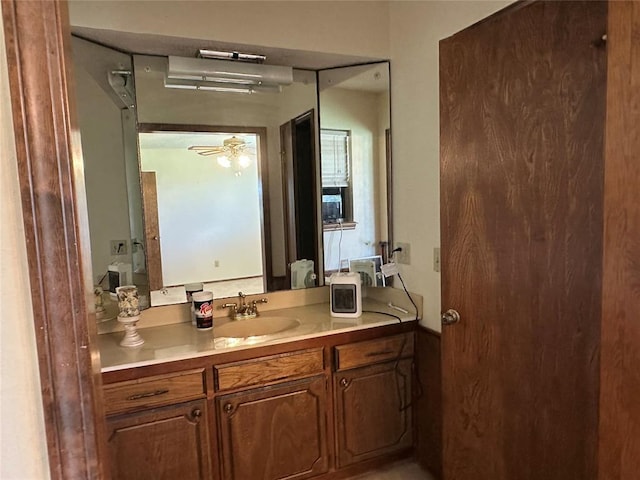 1721 E Ridgeview Ter, Mustang, OK 73064 - bathroom with ceiling fan and vanity