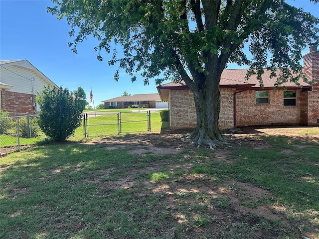 1721 E Ridgeview Ter, Mustang, OK 73064 - view of yard with fence and a gate
