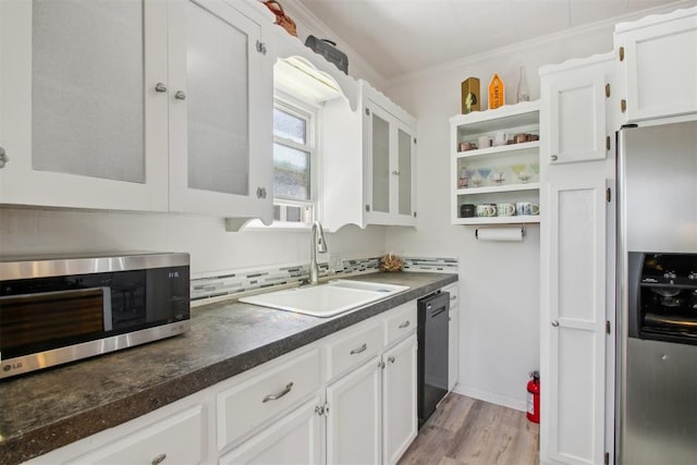 1912 NW 22nd St, Oklahoma City, OK 73106 - kitchen featuring appliances with stainless steel finishes, white cabinetry, dark countertops, open shelves, and light wood finished floors