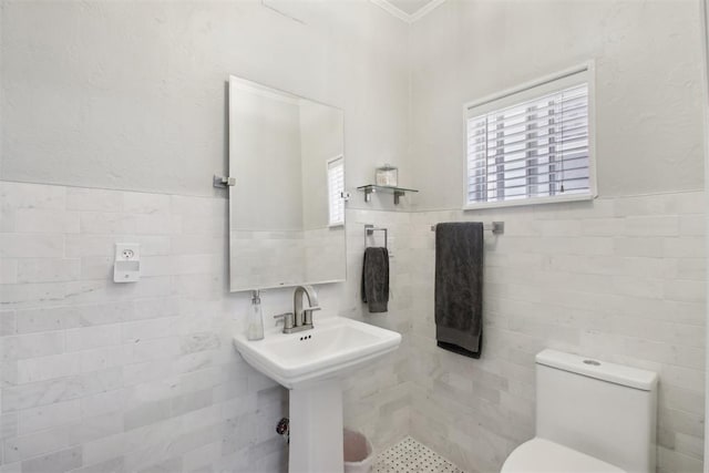 1912 NW 22nd St, Oklahoma City, OK 73106 - half bathroom featuring tile walls, ornamental molding, and a wainscoted wall