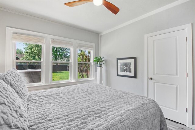 1912 NW 22nd St, Oklahoma City, OK 73106 - bedroom with crown molding, wood finished floors, and ceiling fan
