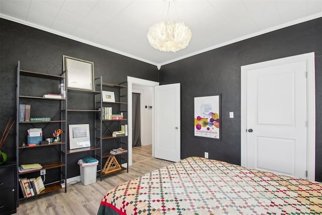 1912 NW 22nd St, Oklahoma City, OK 73106 - bedroom featuring ornamental molding, wood finished floors, and a chandelier