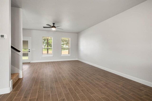 2375 Clubhouse Dr, Blanchard, OK 73010 - unfurnished living room with stairway, baseboards, a ceiling fan, and dark wood-style flooring