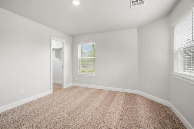 2375 Clubhouse Dr, Blanchard, OK 73010 - unfurnished room with baseboards, visible vents, and light carpet