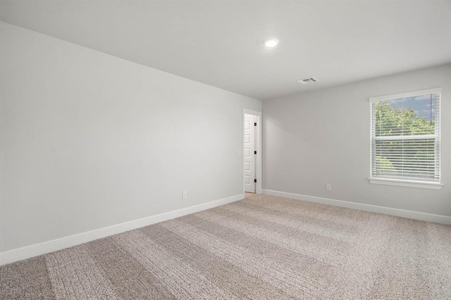 2375 Clubhouse Dr, Blanchard, OK 73010 - empty room with baseboards, light carpet, recessed lighting, and visible vents
