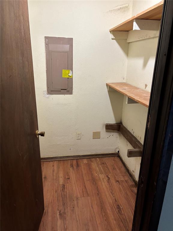 interior space featuring wood finished floors and electric panel