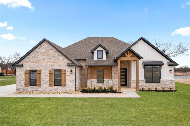 2217 Winter Creek Blvd, Blanchard, OK 73010 - view of front of home with board and batten siding, roof with shingles, a front yard, and stone siding