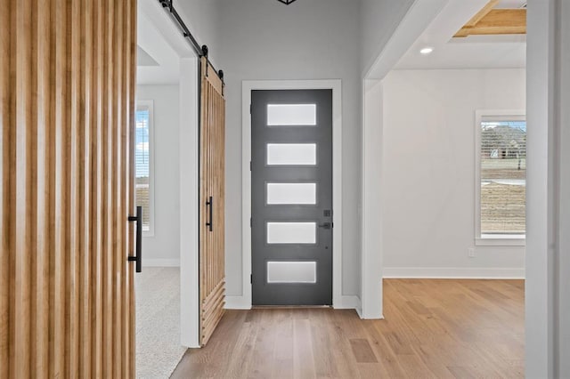 2217 Winter Creek Blvd, Blanchard, OK 73010 - entryway with baseboards, a barn door, and light wood finished floors