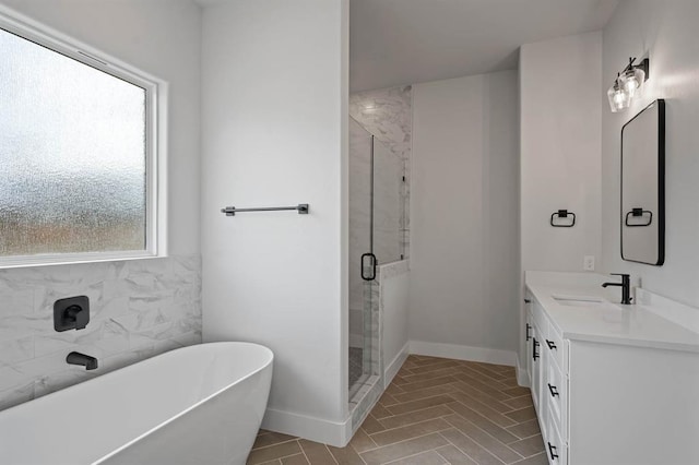 2217 Winter Creek Blvd, Blanchard, OK 73010 - bathroom with a freestanding tub, a shower stall, baseboards, and vanity