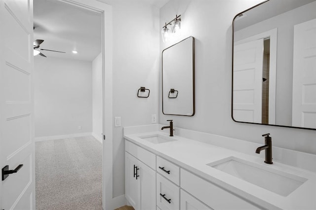 2217 Winter Creek Blvd, Blanchard, OK 73010 - full bath featuring double vanity, a ceiling fan, baseboards, and a sink