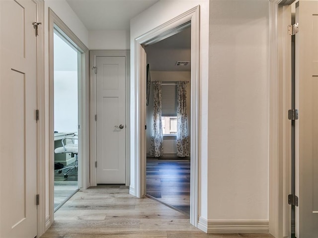 11021 SW 35th Ter, Yukon, OK 73099 - corridor with light wood-type flooring and a desk