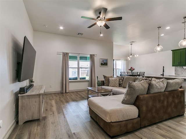 11021 SW 35th Ter, Yukon, OK 73099 - living area with a ceiling fan, wood finished floors, baseboards, recessed lighting, and a chandelier