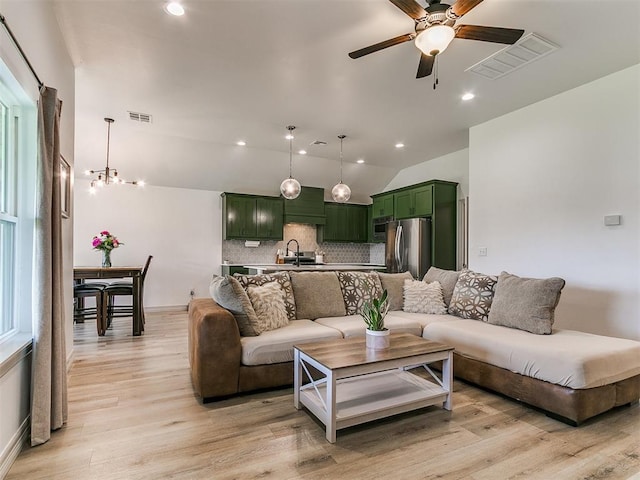 11021 SW 35th Ter, Yukon, OK 73099 - living area featuring a ceiling fan, light wood-style flooring, vaulted ceiling, recessed lighting, and baseboards