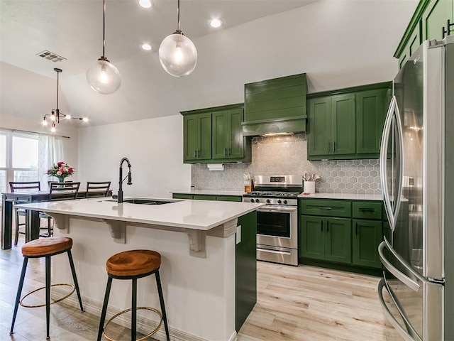 11021 SW 35th Ter, Yukon, OK 73099 - kitchen with stainless steel appliances, green cabinetry, a sink, custom range hood, and vaulted ceiling