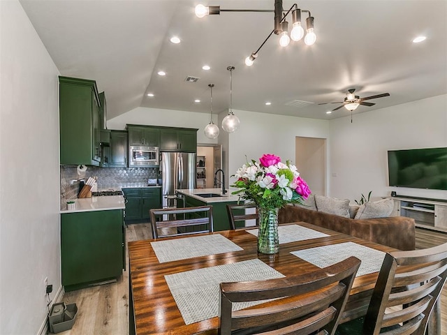 11021 SW 35th Ter, Yukon, OK 73099 - dining room with light wood-type flooring, a ceiling fan, recessed lighting, and vaulted ceiling