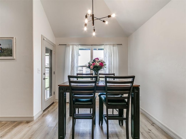 11021 SW 35th Ter, Yukon, OK 73099 - dining space featuring lofted ceiling, a chandelier, healthy amount of natural light, and light wood-style flooring