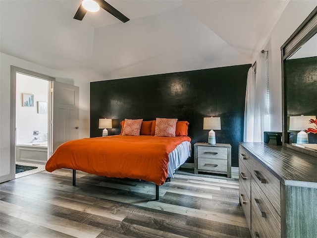 11021 SW 35th Ter, Yukon, OK 73099 - bedroom with vaulted ceiling, wood finished floors, ensuite bathroom, and a ceiling fan
