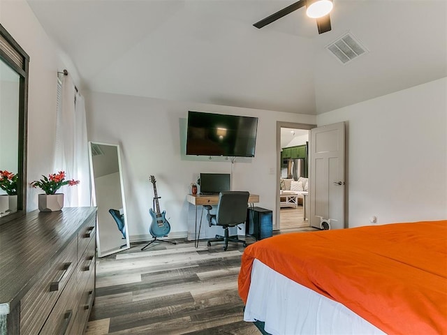 11021 SW 35th Ter, Yukon, OK 73099 - bedroom featuring wood finished floors, an office area, baseboards, and ceiling fan