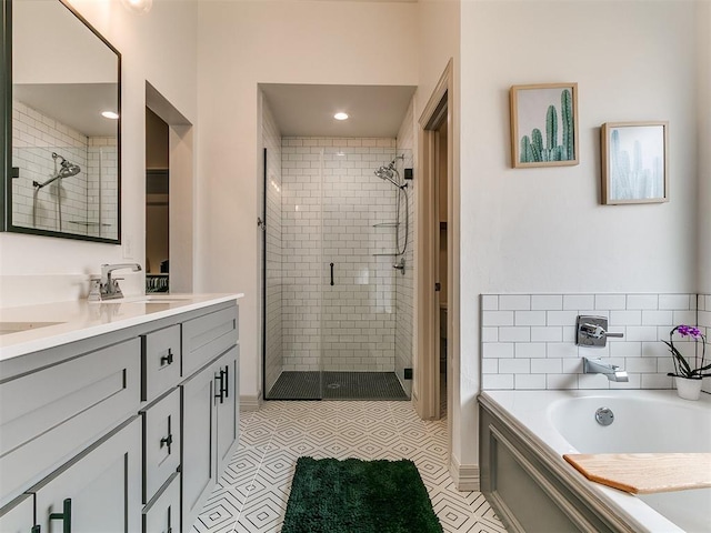11021 SW 35th Ter, Yukon, OK 73099 - bathroom with a stall shower, a bath, and double vanity