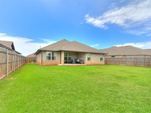 11021 SW 35th Ter, Yukon, OK 73099 - rear view of property featuring outdoor lounge area, brick siding, cooling unit, and a patio area