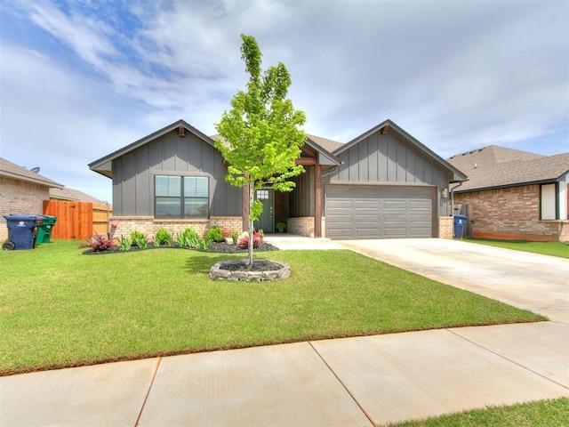 11021 SW 35th Ter, Yukon, OK 73099 - single story home with board and batten siding, an attached garage, concrete driveway, and brick siding