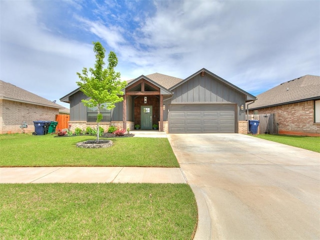 11021 SW 35th Ter, Yukon, OK 73099 - single story home featuring board and batten siding, a garage, concrete driveway, and brick siding