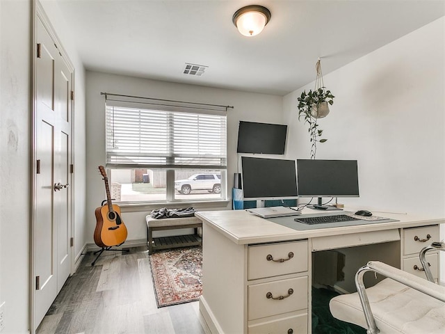 11021 SW 35th Ter, Yukon, OK 73099 - office area featuring wood finished floors and baseboards