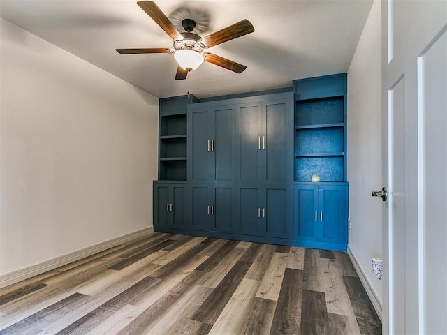 11021 SW 35th Ter, Yukon, OK 73099 - unfurnished bedroom with dark wood-style floors, baseboards, and ceiling fan