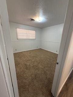 117 Phillips Ln, Clinton, OK 73601 - empty room with dark colored carpet