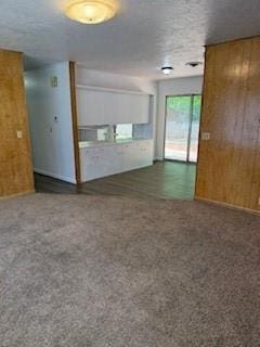 117 Phillips Ln, Clinton, OK 73601 - spare room featuring wooden walls