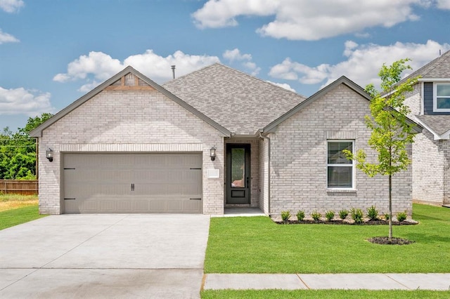 view of front of property with roof with shingles, brick siding, a garage, a front yard, and driveway