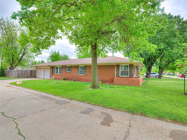 2429 Barclay Rd, Oklahoma City, OK 73120 - ranch-style home featuring a garage, brick siding, and driveway