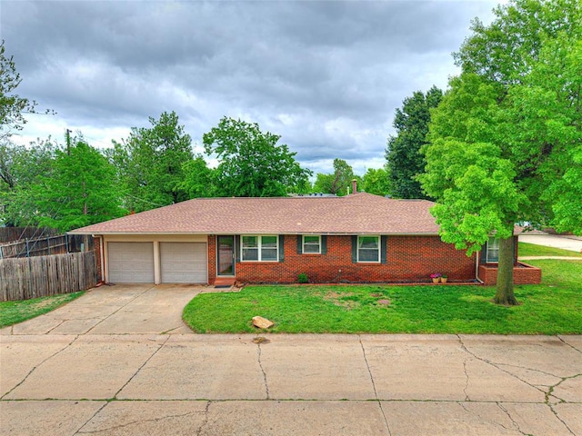 2429 Barclay Rd, Oklahoma City, OK 73120 - ranch-style house featuring an attached garage, concrete driveway, brick siding, and a shingled roof