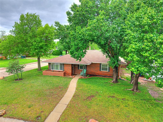 2429 Barclay Rd, Oklahoma City, OK 73120 - single story home featuring brick siding, a front yard, and a shingled roof