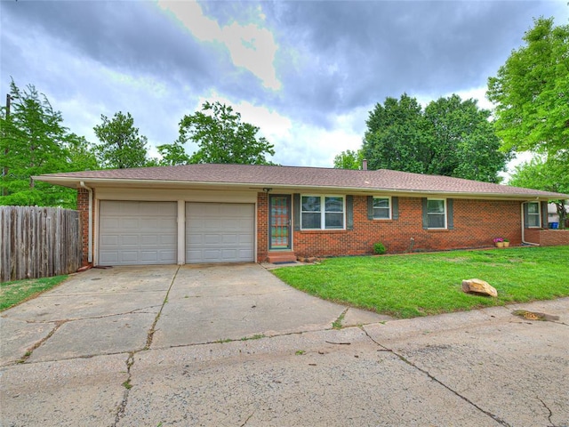2429 Barclay Rd, Oklahoma City, OK 73120 - ranch-style home featuring brick siding, an attached garage, and driveway