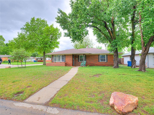 2429 Barclay Rd, Oklahoma City, OK 73120 - single story home featuring a front yard and brick siding