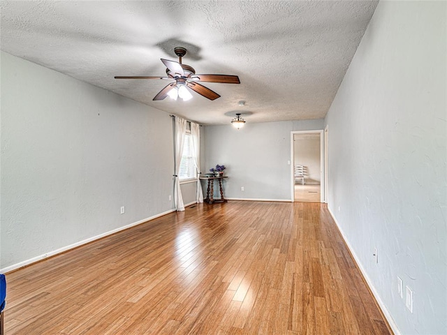 2429 Barclay Rd, Oklahoma City, OK 73120 - unfurnished room with a textured ceiling, ceiling fan, and light wood-type flooring