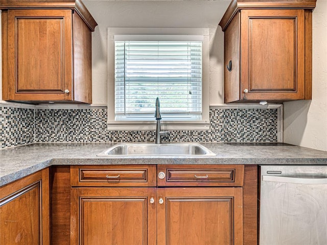 2429 Barclay Rd, Oklahoma City, OK 73120 - kitchen with stainless steel dishwasher, brown cabinets, and backsplash