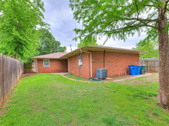 2429 Barclay Rd, Oklahoma City, OK 73120 - rear view of property with brick siding and a fenced backyard