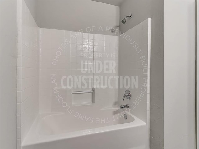 bathroom with shower / washtub combination