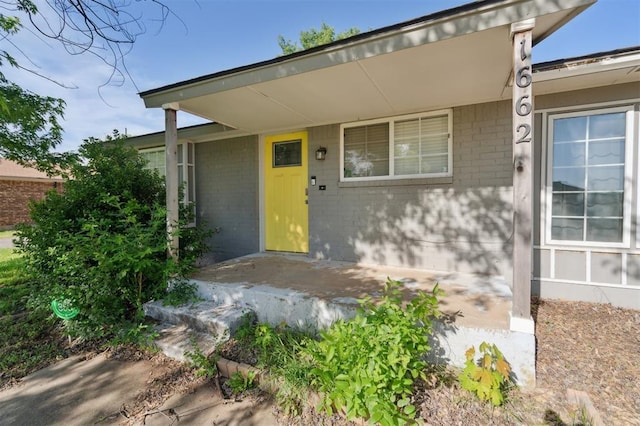 1662 NE 6th St, Moore, OK 73160 - property entrance with brick siding