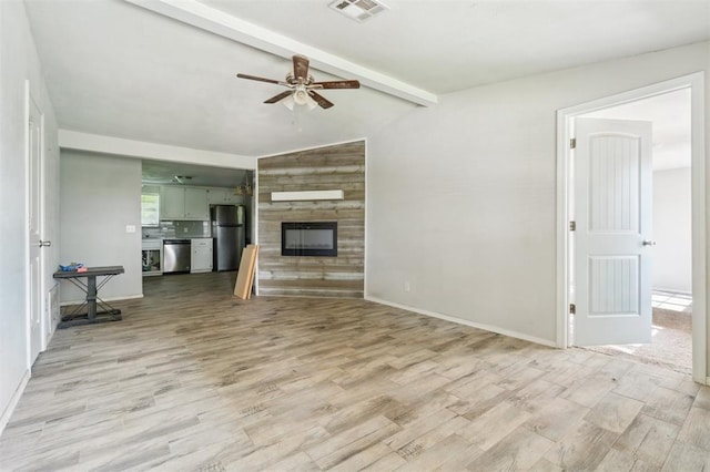 1662 NE 6th St, Moore, OK 73160 - unfurnished living room featuring a large fireplace, ceiling fan, light wood-type flooring, and baseboards