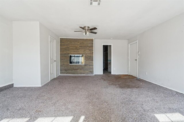 1662 NE 6th St, Moore, OK 73160 - unfurnished living room with a ceiling fan, carpet floors, and baseboards