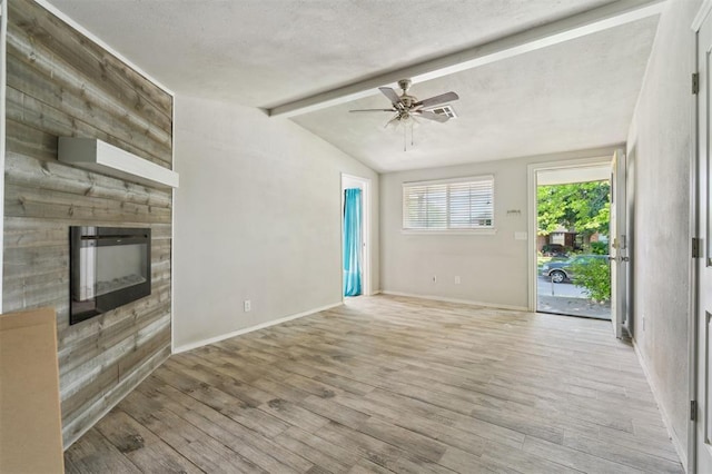 1662 NE 6th St, Moore, OK 73160 - unfurnished living room with light wood-style flooring, a ceiling fan, a fireplace, and baseboards
