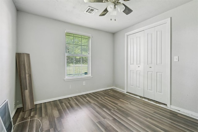 1662 NE 6th St, Moore, OK 73160 - unfurnished bedroom featuring wood finished floors, a closet, baseboards, and ceiling fan